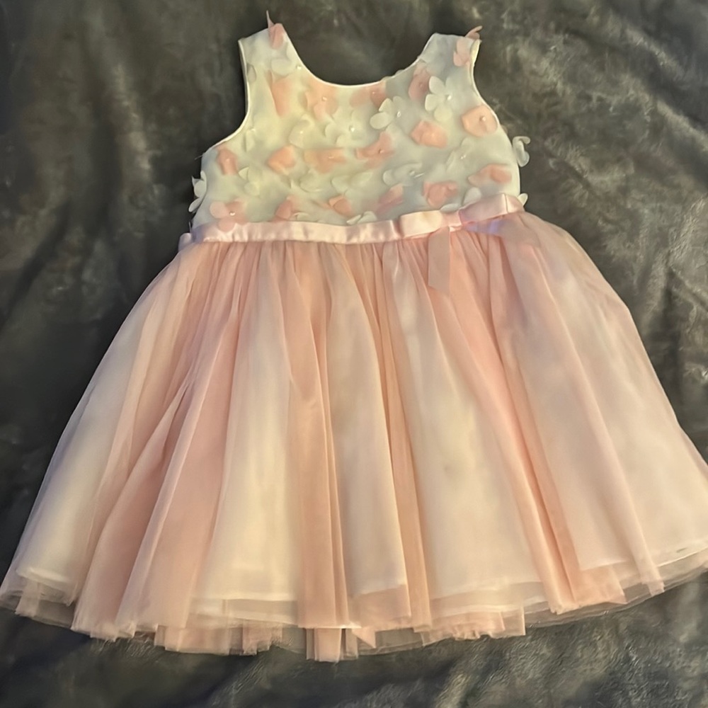 Beautiful pink dress with flowers on top. Perfect for Easter. Size 2T.